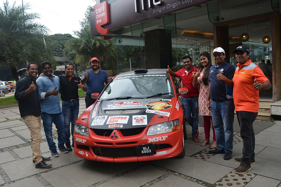 Rallyist-pose-with-one-of-the-rally-cars-1.