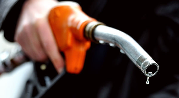 (FILES) In a file picture taken on February 28, 2012 a motorist refuels at a gas pump in the northern city of Lille. French Prime Minister Jean-Marc Ayrault promised on August 22, 2012 a modest and temporary cut to the taxes on petrol and diesel in order to reduce pump prices for drivers. AFP PHOTO / PHILIPPE HUGUENPHILIPPE HUGUEN/AFP/GettyImages