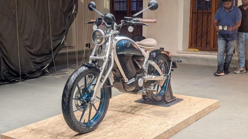 Flying Flea C6 side profile showcasing retro-futuristic design and Girder fork suspension