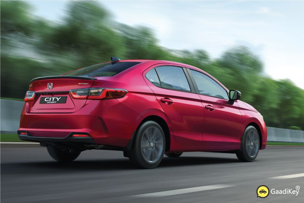 2025 Honda City Sport rear angle featuring black trunk lip spoiler and LED taillights