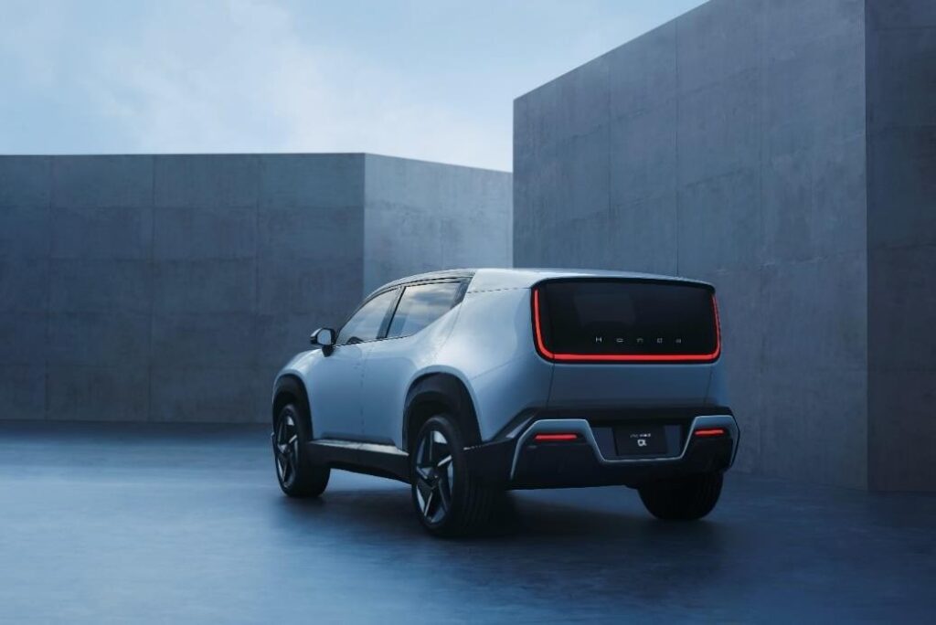 Rear three-quarter view of the Honda 0 α (Alpha) EV prototype, highlighting its U-shaped 'H O N D A' text tail light, '0 α' badge, and aerodynamic design.