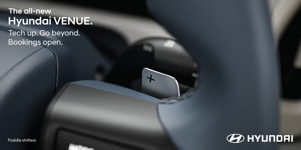 Close-up of the steering wheel-mounted paddle shifters on the all-new 2025 Hyundai Venue, highlighting its sporty automatic transmission features.